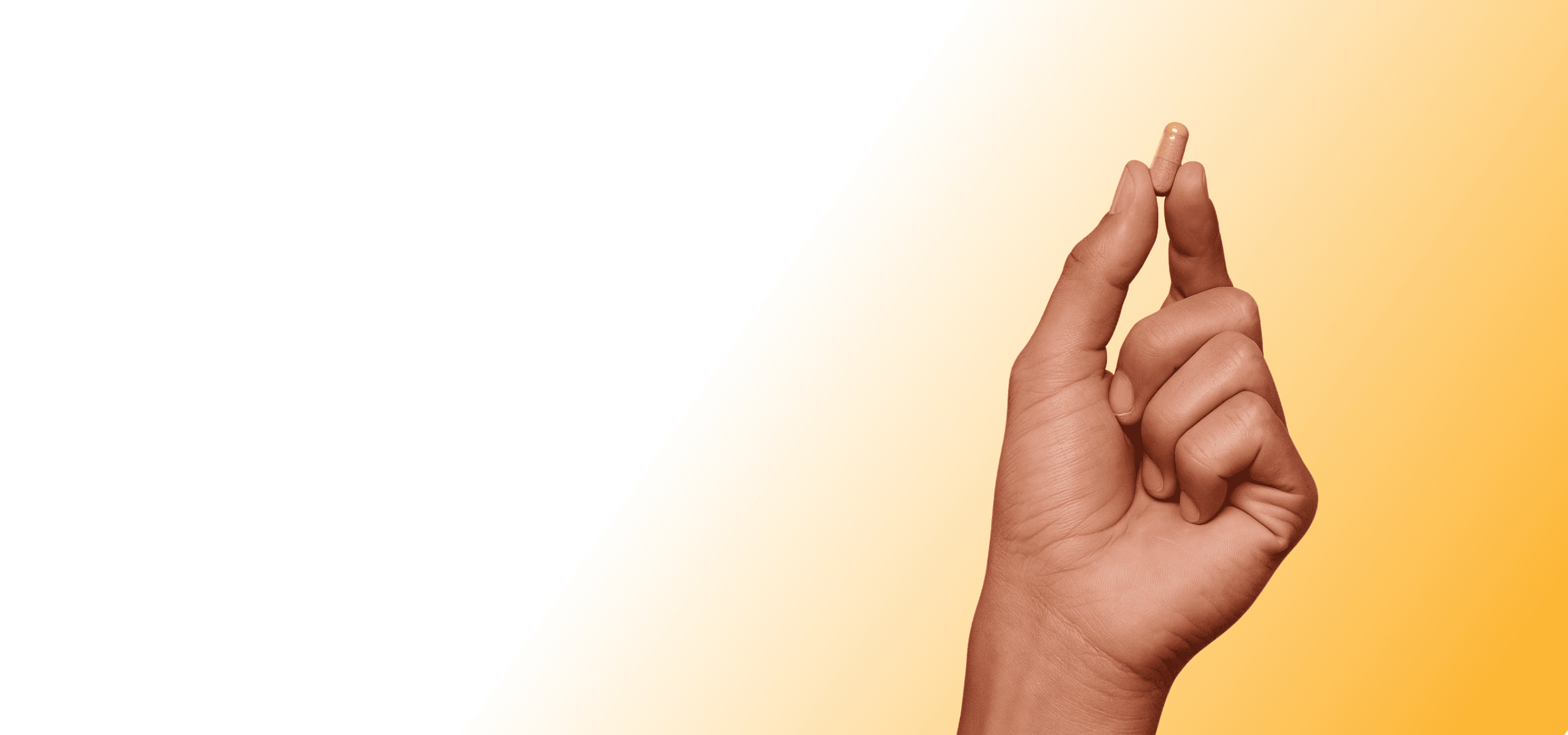 Hand holding LIMITLESS pill